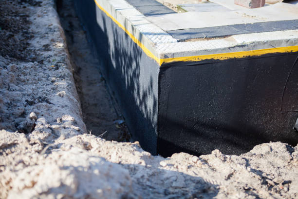 Professional Basement Waterproofing technician working in Branchport, NY